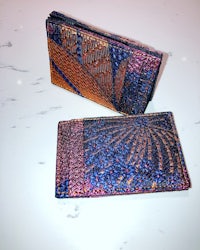 a pair of blue and orange wallets on a table